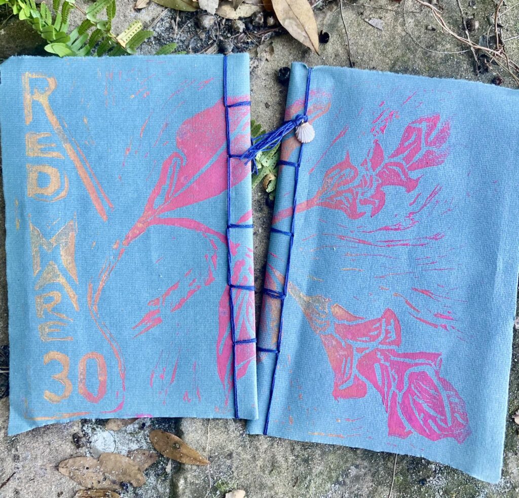 Red Mare #30 Hand carved block print cover of fuchsia ginger flower. Photo by Su Zi.